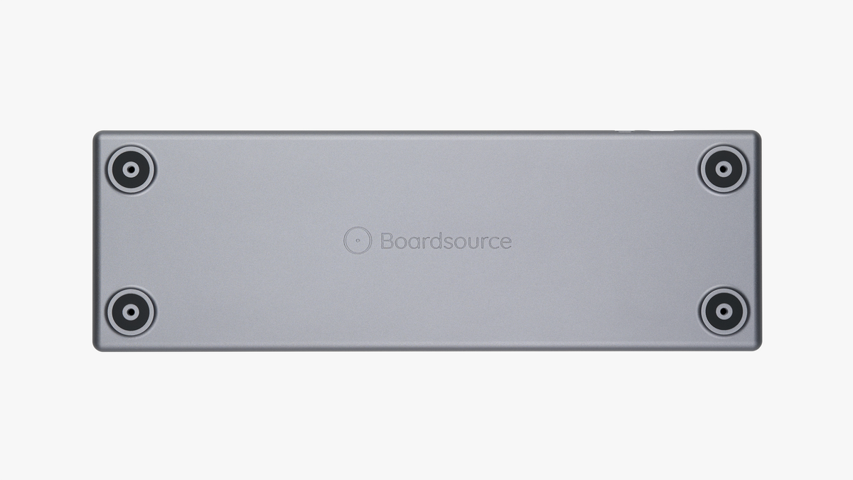 Back of Rechteck keyboard showing engraved Boardsource logo and tilt leg mounting points with silicone non-slip feet