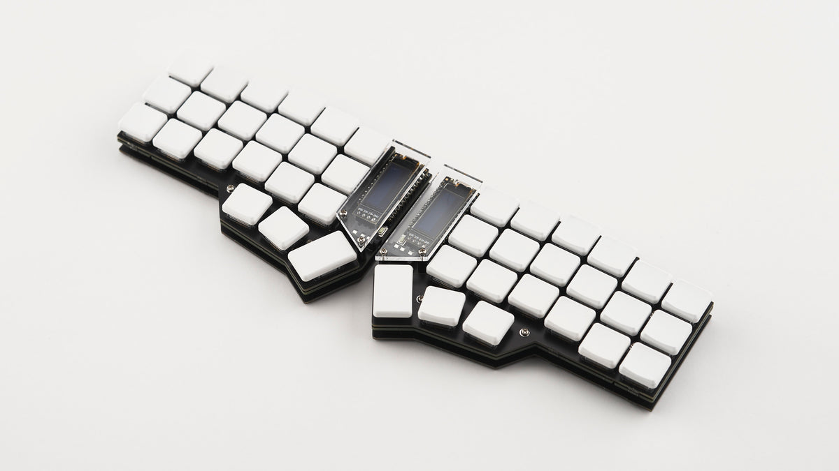 Assembled Corne split keyboard using Corne DIY Kit with FR4 case and low-profile white keycaps on white background