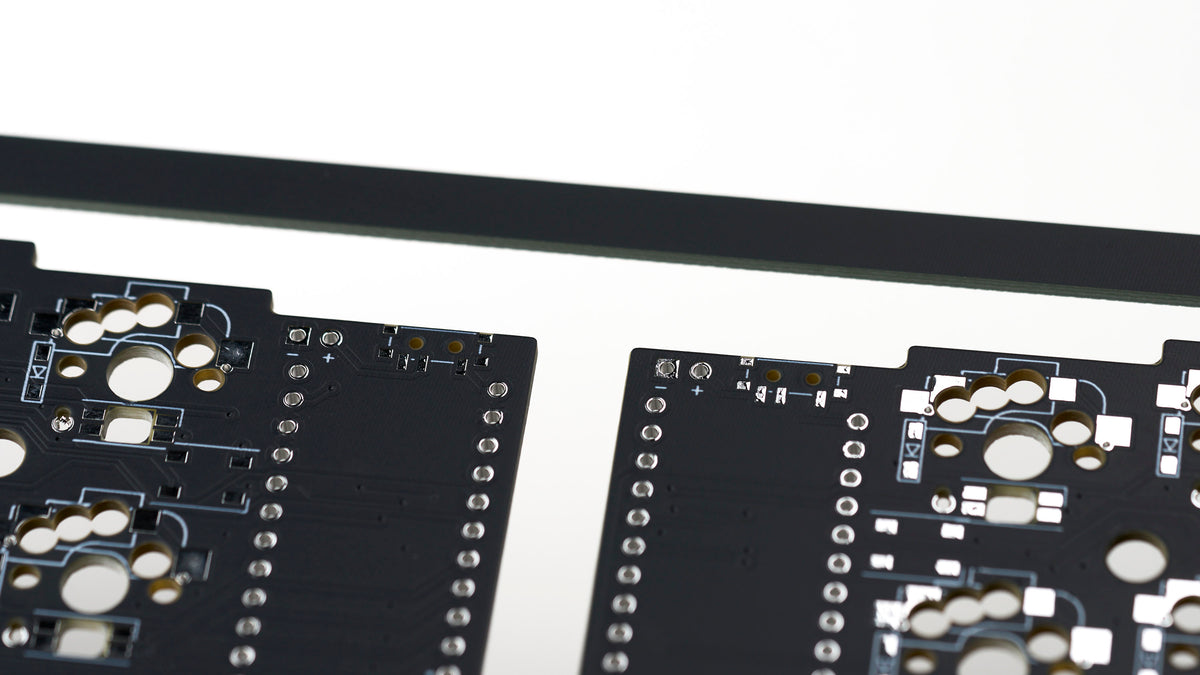 Corne v3.6 solderable PCB closeup showing power switch and battery lead pads for wireless builds