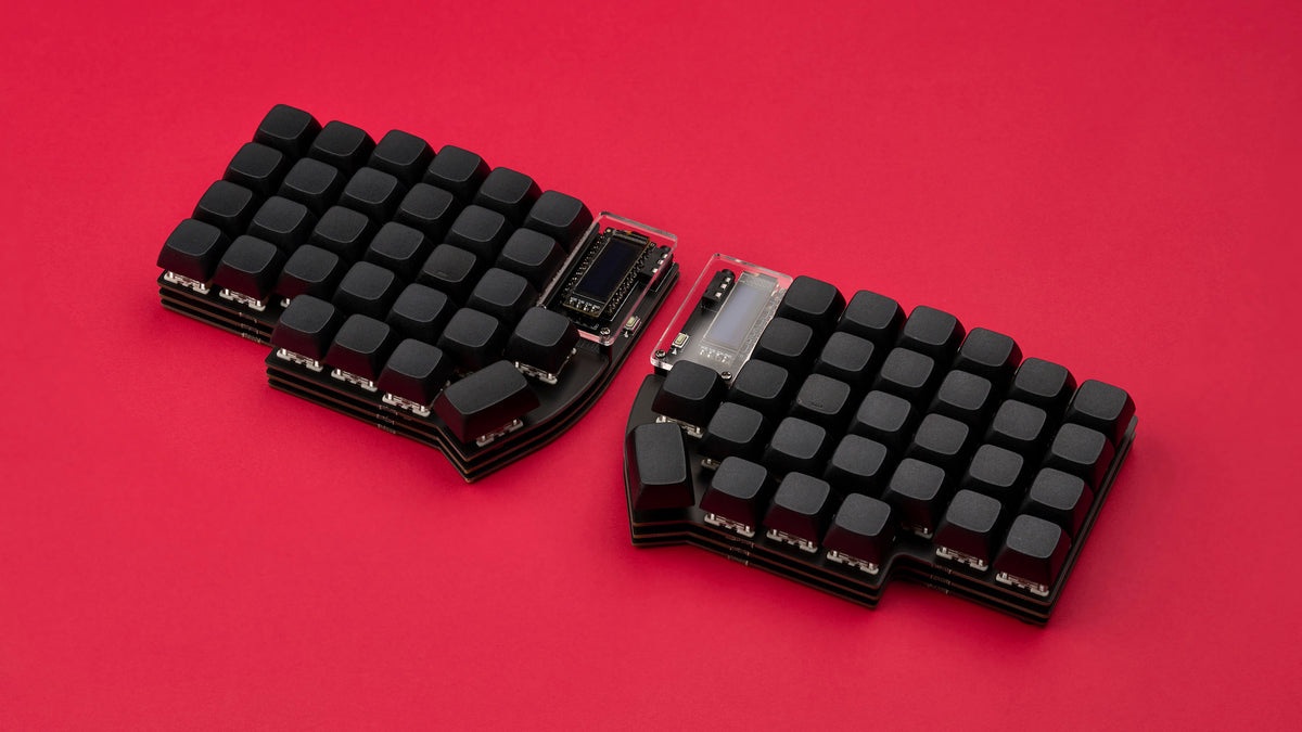 A black Lily58 keyboard with dark keycaps on a bold red background.