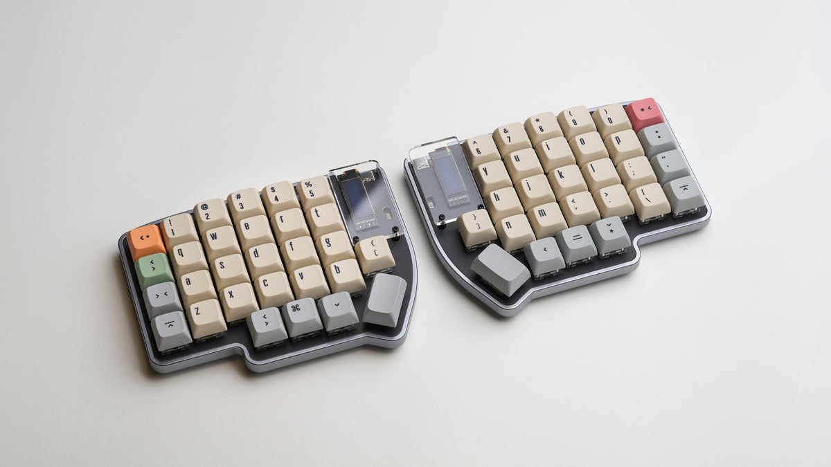 Angled shot of Lily Pad keyboard with beige and gray keycaps, showing clean aluminum case finish.
