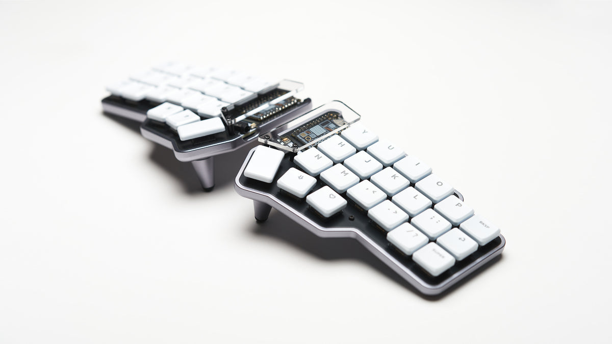 Unicorne LP keyboard angled upward to show side profile and tenting legs, on white background